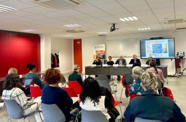 photos of people sitting on chairs with their backs to the camera, facing the directors and members of the executive committee